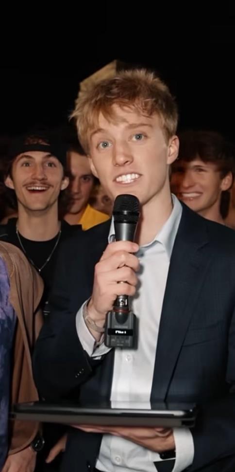 Jax Johnson with mic at Baylor event